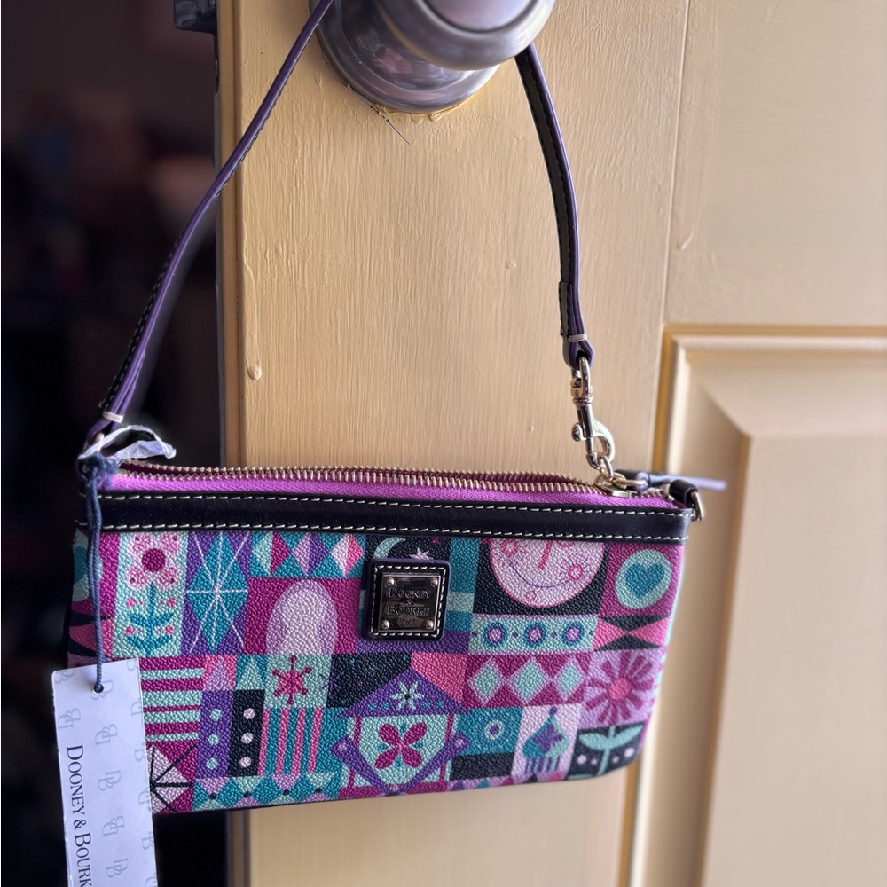 Disney Dooney & Bourke “It’s a Small World” Purple Wristlet  BNWT